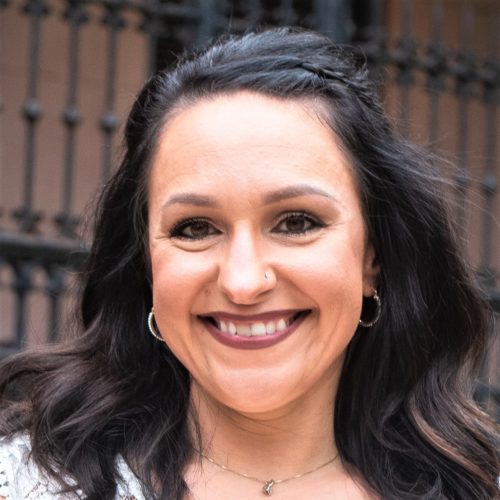 A woman smiling at the camera.